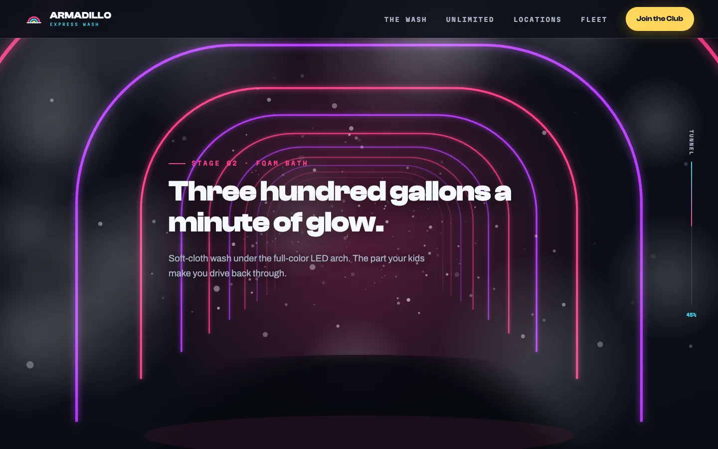Mid-ride through the scroll tunnel: violet and magenta LED arches glow around the Stage 02 Foam Bath headline, 'Three hundred gallons a minute of glow,' with foam bubbles drifting through the frame, a dark hood silhouette at the bottom of the viewport, and a tunnel progress rail on the right reading 45%.