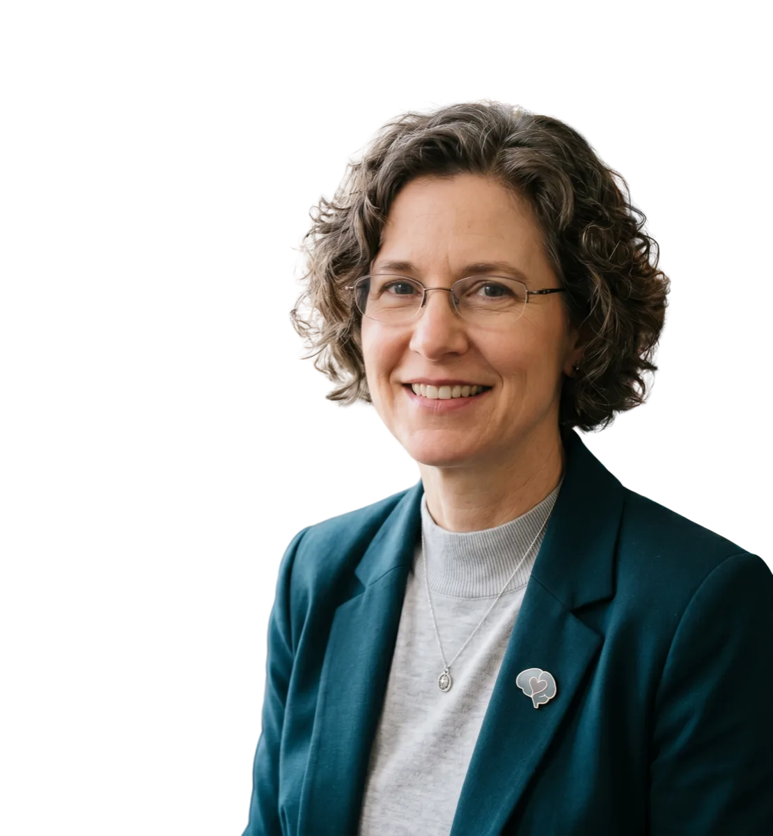 Portrait of Dr. Margaret Calloway, founder and medical director, a board-certified psychiatrist, in a teal blazer
